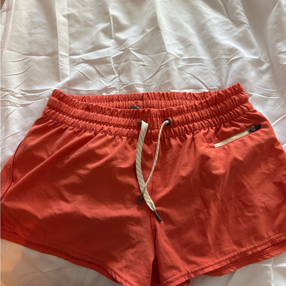 Vuori Women's Athletic Shorts in Bright Orange